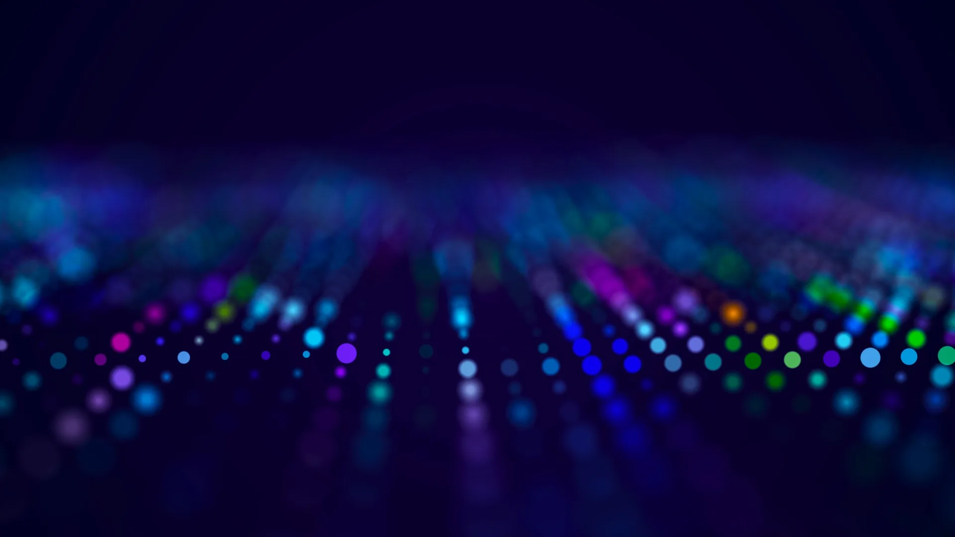 Farbige digitale Lichtpunkte auf dunklem Hintergrund